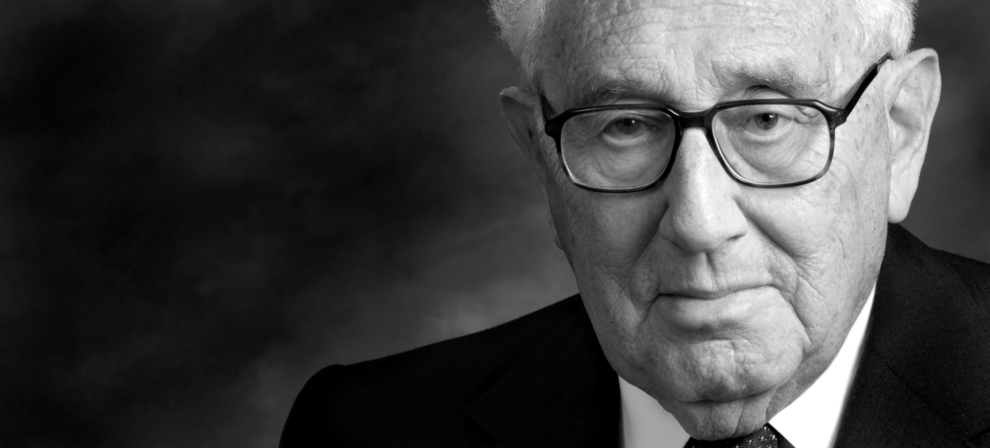 Panoramic black-and-white portrait of Henry Kissinger