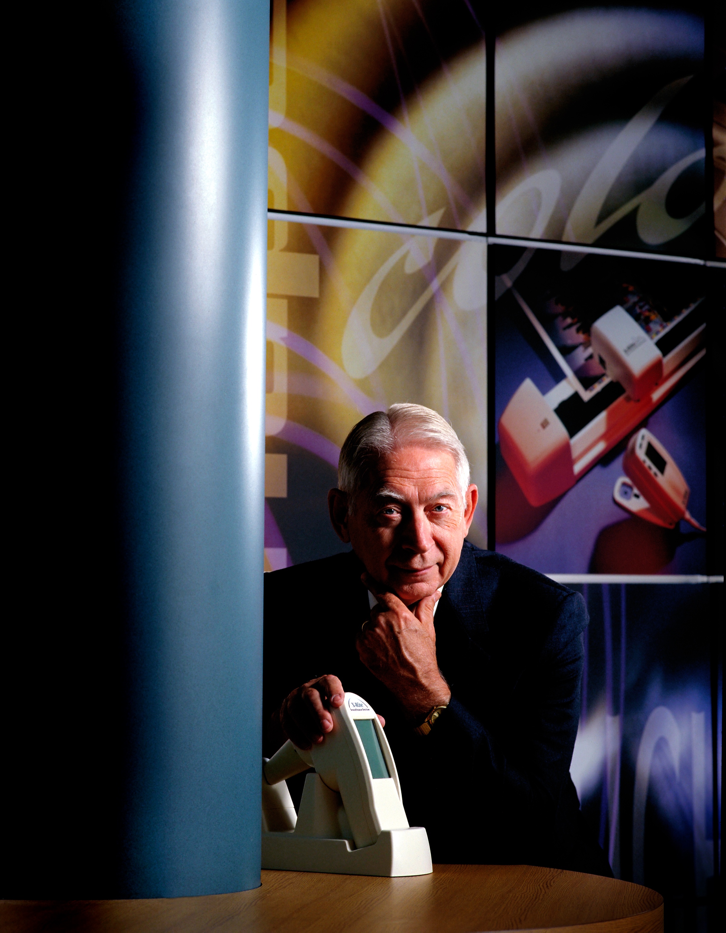 Darrell Ted Thompson with an X-Rite color-measurement instrument