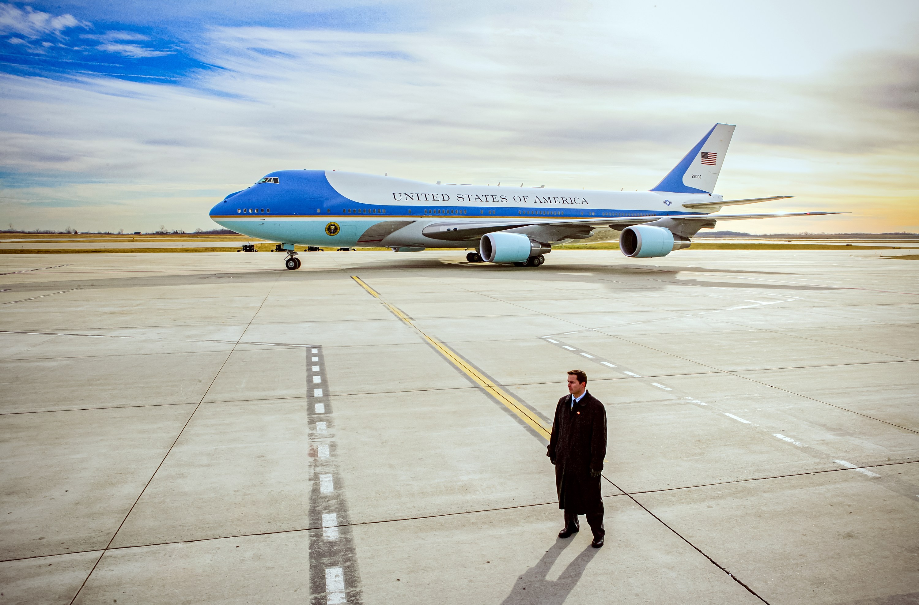 Air Force One on the Grand Rapids tarmac beyond a yellow line