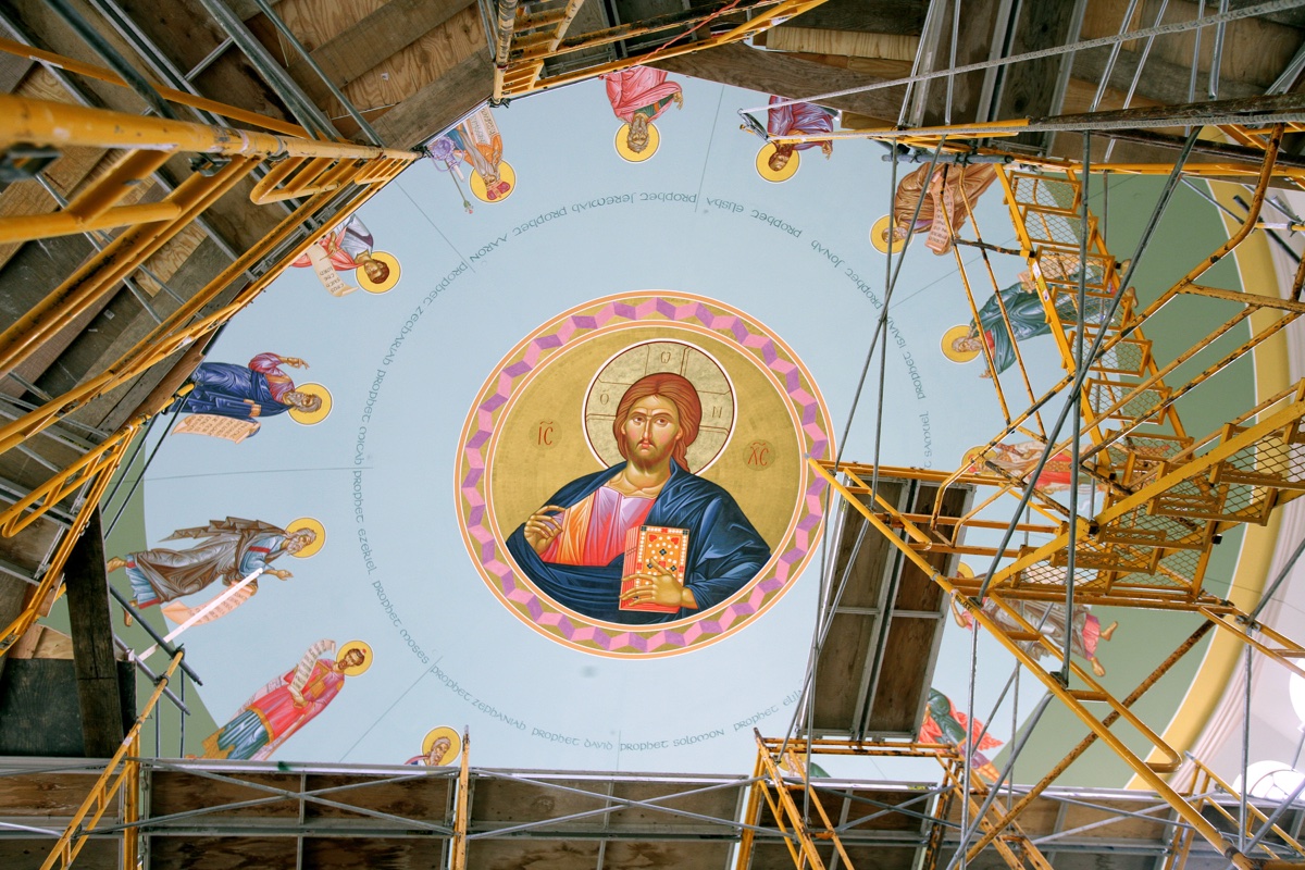 The Christ Pantocrator and prophets in the dome of St. Nicholas Antiochian Orthodox Church surrounded by yellow scaffolding during the icon installation
